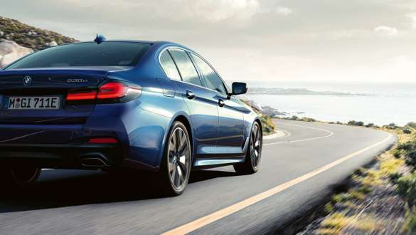 Integral Active steering BMW 5 Series Sedan G30 Integral Active steering BMW 5 Series Sedan G30 Facelift 2020 three-quarter rear view driving shot