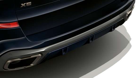 M Sport exhaust system BMW X5 M50i G05 M Sport exhaust system BMW X5 M50i G05 2018 SUV close-up rear view