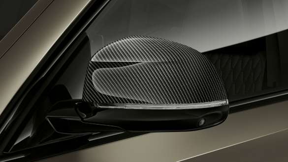 BMW X6 M50i M Carbon mirror caps G06 BMW X6 M50i M50d G06 2018 SUV with close-up on M Carbon mirror caps
