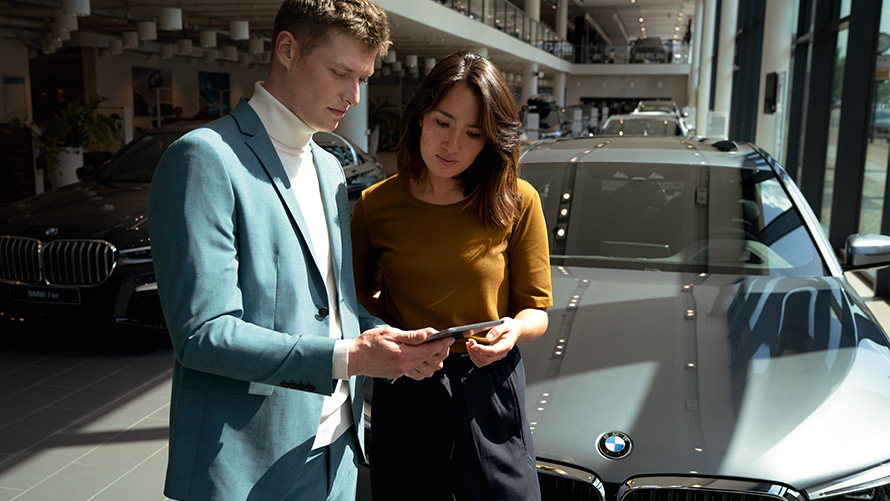 BMW employee advises a customer BMW employee advises a customer