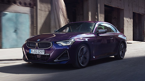 BMW 2 Series BMW 2 Series Coupé G42 three-quarter front view driving on the street