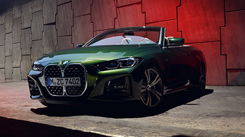 BMW 4 Series Convertible G23 three-quarter side view with model BMW 4 Series BMW 4 Series Convertible G23 three-quarter side view with model