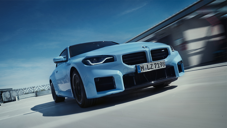 BMW M2 G87 front view driving on the street BMW M Series BMW M2 G87 front view driving on the street