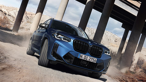 BMW X3 M F97 three-quarter front view driving BMW M Series BMW X3 M F97 three-quarter front view driving