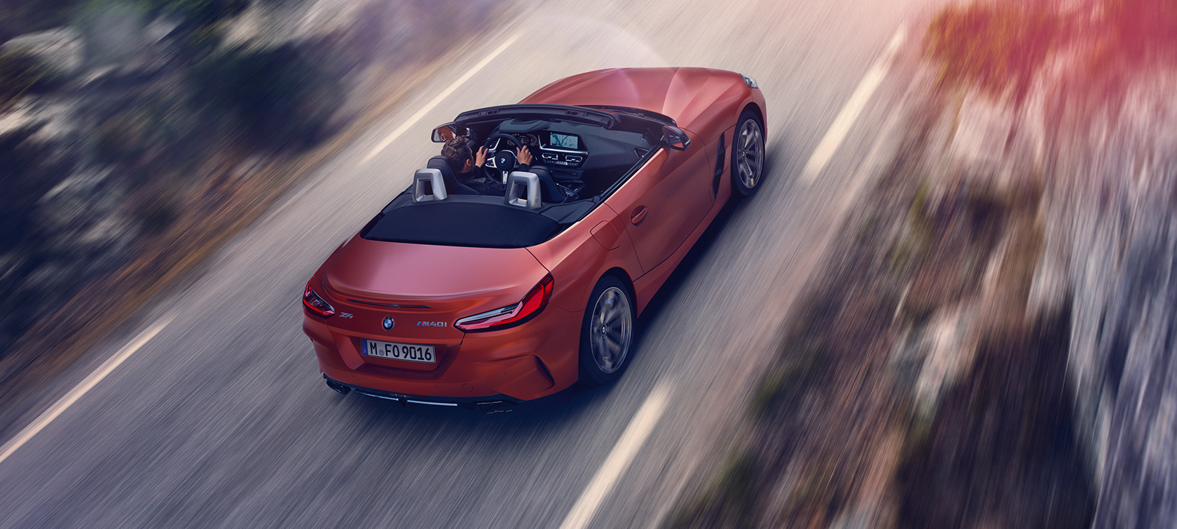 BMW Z4 Roadster (G29) three-quarter rear view from bird´s eye view driving BMW Z4 Roadster (G29) three-quarter rear view from bird´s eye view driving