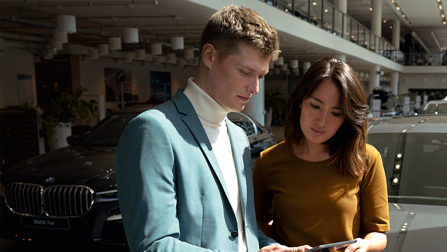 BMW employee advises a customer BMW employee advises a customer