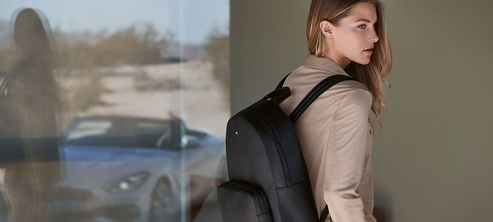 A female model is wearing pieces of the BMW Collection. A female model is wearing pieces of the BMW Collection.