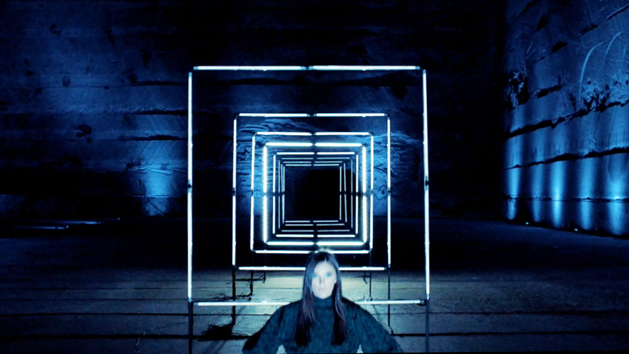BMW Luxury Class manifesto BMW Luxury Class: Woman in black dress stands in front of light installation