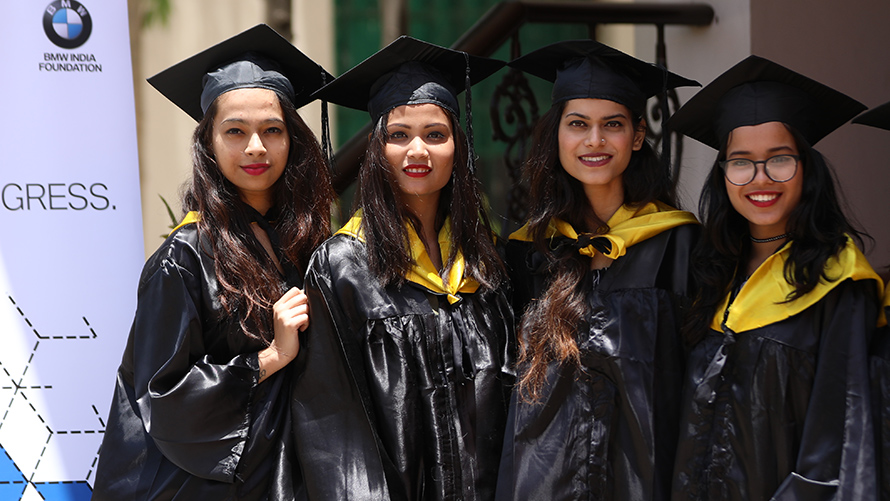 Social engagement BMW Sustainability BMW Sustainability Social engagement four women in black graduation robe